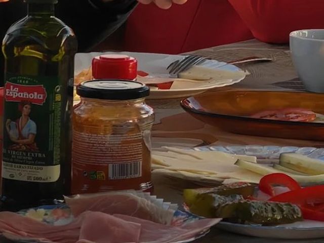 Breakfast on the table: olive oil, cured ham, cheese and vegetables